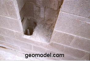 Photo showing rebar and air in concrete block wall